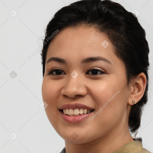 Joyful latino young-adult female with medium  brown hair and brown eyes