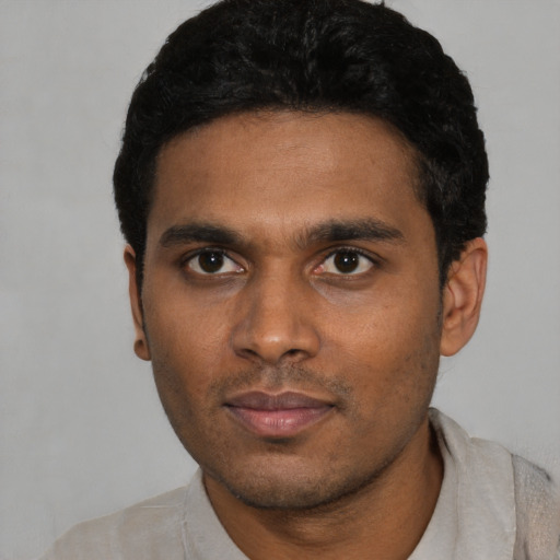 Neutral black young-adult male with short  black hair and brown eyes