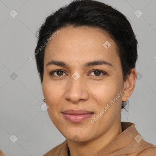 Joyful latino young-adult female with short  brown hair and brown eyes