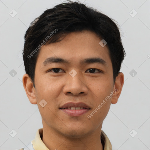 Joyful asian young-adult male with short  brown hair and brown eyes