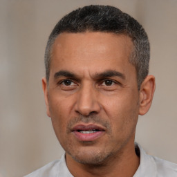Neutral white adult male with short  black hair and brown eyes