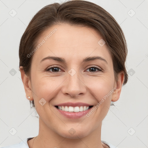 Joyful white young-adult female with short  brown hair and grey eyes