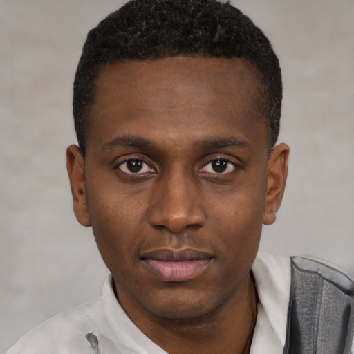 Neutral black young-adult male with short  black hair and brown eyes