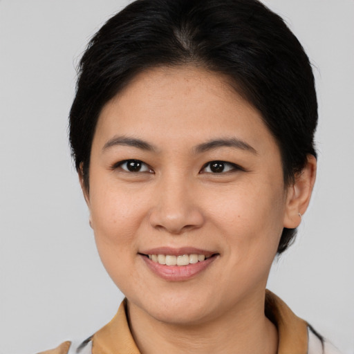 Joyful white young-adult female with medium  brown hair and brown eyes