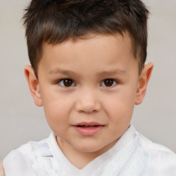 Joyful white child male with short  brown hair and brown eyes