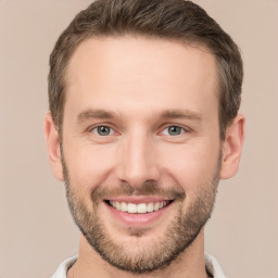 Joyful white young-adult male with short  brown hair and brown eyes