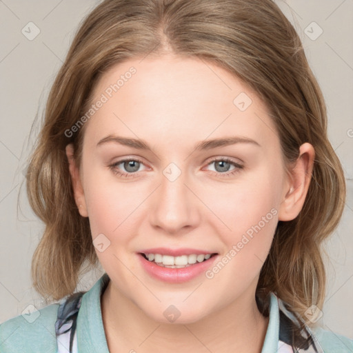 Joyful white young-adult female with medium  brown hair and blue eyes