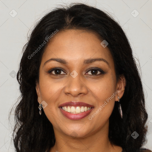 Joyful black young-adult female with long  brown hair and brown eyes