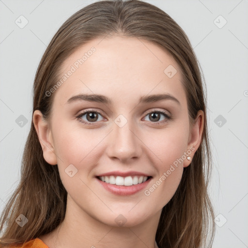 Joyful white young-adult female with long  brown hair and grey eyes