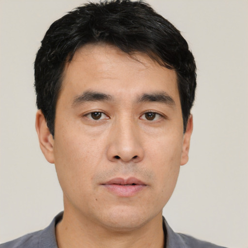Neutral asian young-adult male with short  black hair and brown eyes