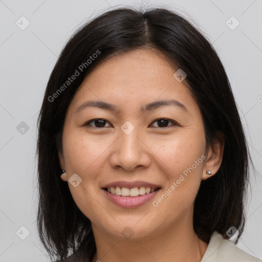 Joyful asian young-adult female with medium  brown hair and brown eyes