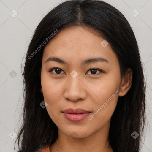 Joyful latino young-adult female with long  brown hair and brown eyes