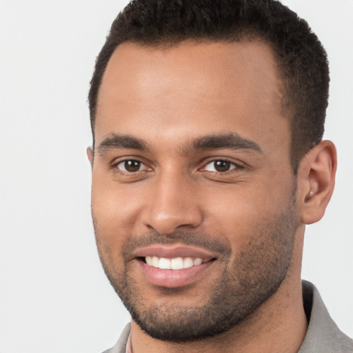 Joyful white young-adult male with short  brown hair and brown eyes