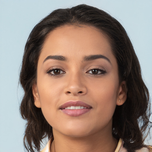 Joyful white young-adult female with medium  brown hair and brown eyes