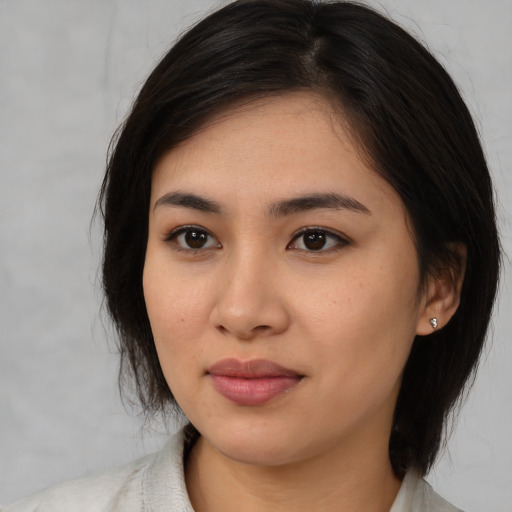 Neutral asian young-adult female with medium  black hair and brown eyes