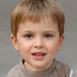 Joyful white child male with short  brown hair and brown eyes