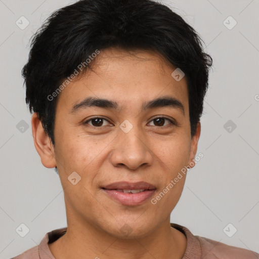 Joyful latino young-adult male with short  brown hair and brown eyes