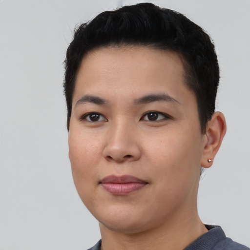 Joyful asian young-adult female with short  black hair and brown eyes
