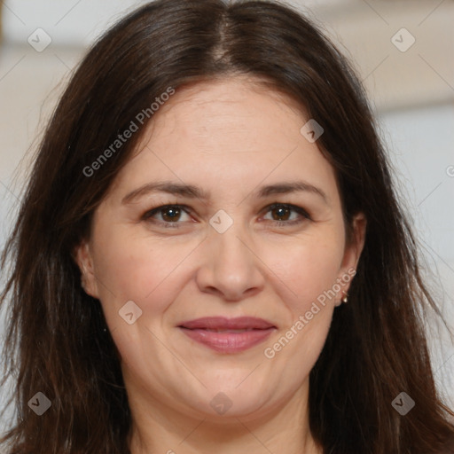 Joyful white adult female with long  brown hair and brown eyes