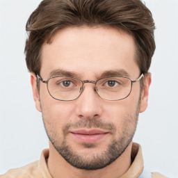 Joyful white adult male with short  brown hair and grey eyes