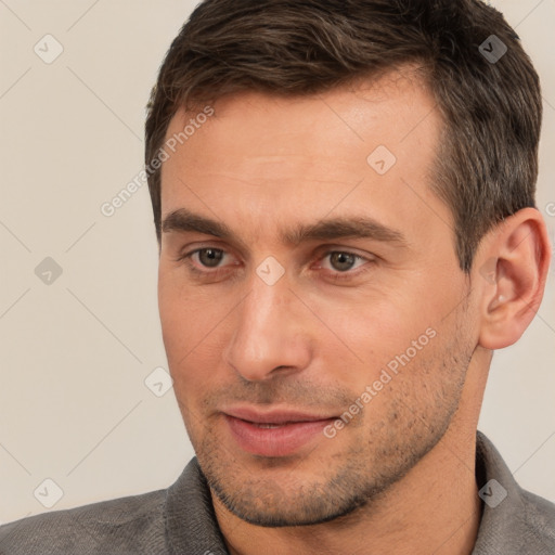 Joyful white adult male with short  brown hair and brown eyes