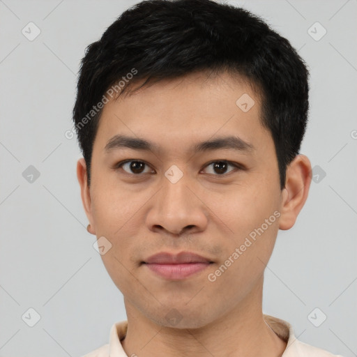 Joyful asian young-adult male with short  black hair and brown eyes