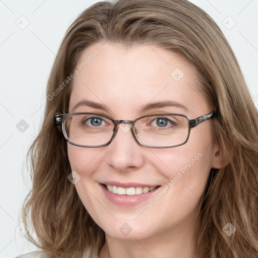 Joyful white young-adult female with long  brown hair and blue eyes