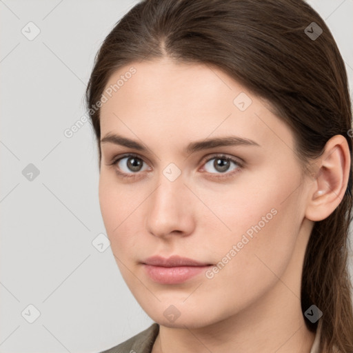 Neutral white young-adult female with medium  brown hair and brown eyes