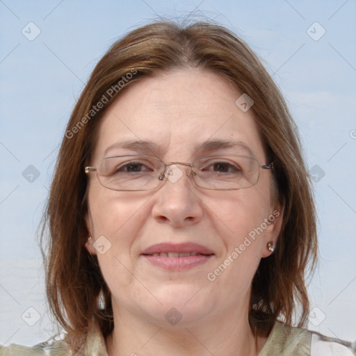 Joyful white adult female with medium  brown hair and blue eyes