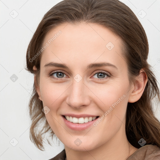 Joyful white young-adult female with medium  brown hair and blue eyes