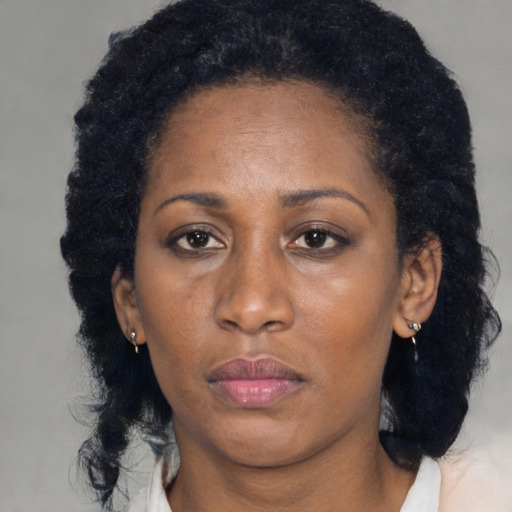 Neutral black adult female with long  black hair and brown eyes