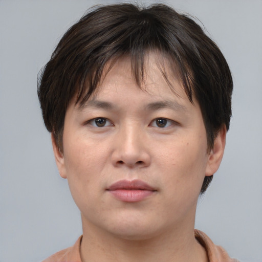 Neutral asian young-adult male with short  brown hair and brown eyes