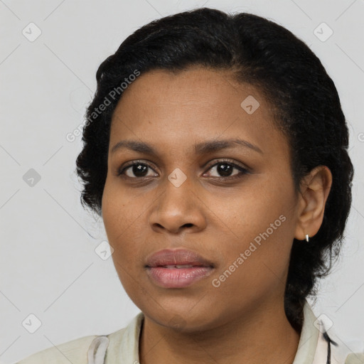 Joyful black young-adult female with medium  black hair and brown eyes