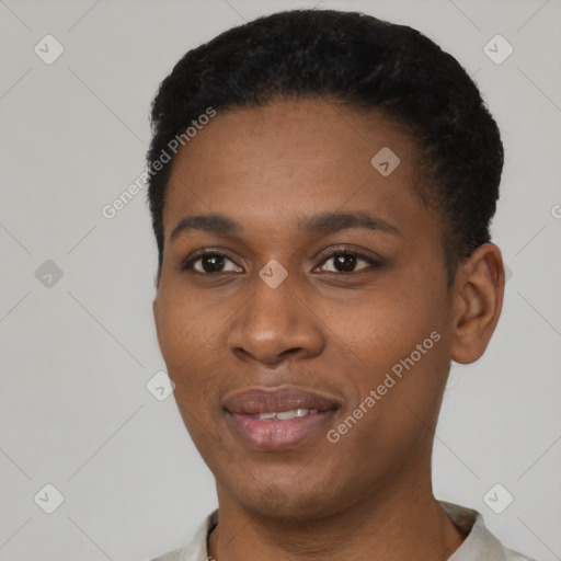 Joyful black young-adult female with short  black hair and brown eyes