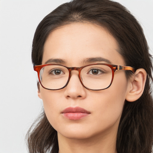 Neutral white young-adult female with long  brown hair and brown eyes