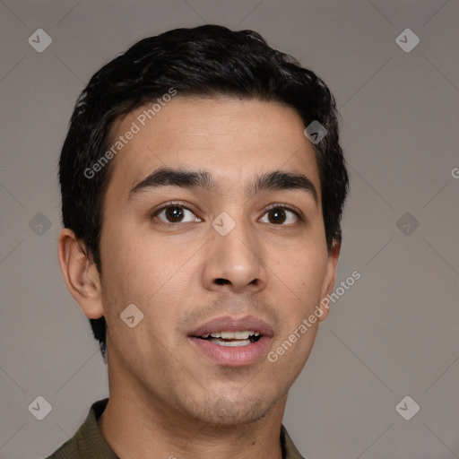 Joyful white young-adult male with short  black hair and brown eyes