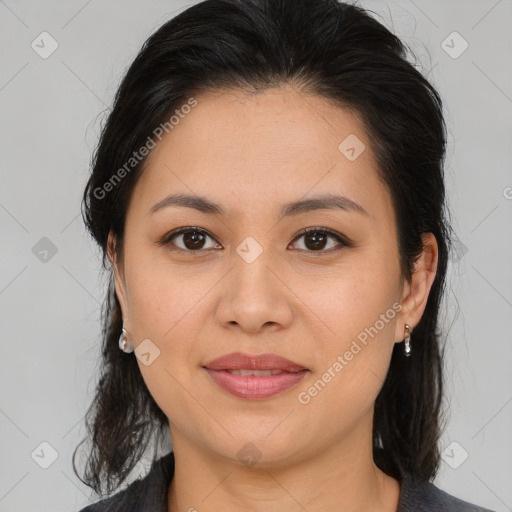 Joyful latino young-adult female with medium  brown hair and brown eyes