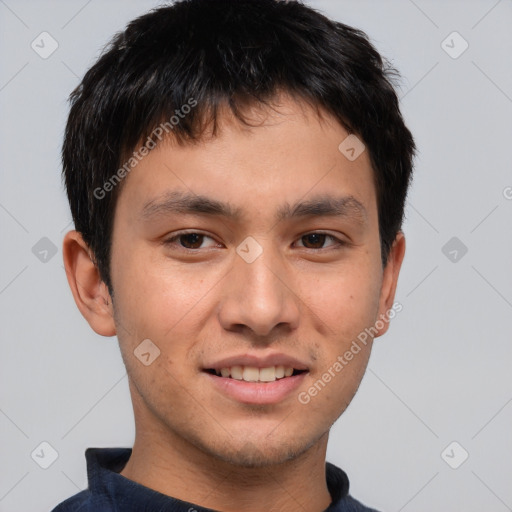 Joyful asian young-adult male with short  brown hair and brown eyes