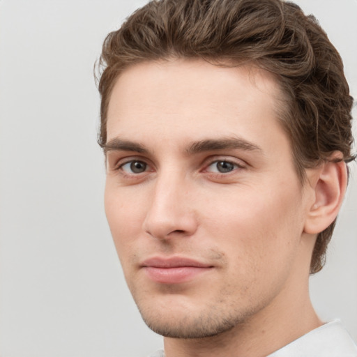 Neutral white young-adult male with short  brown hair and grey eyes