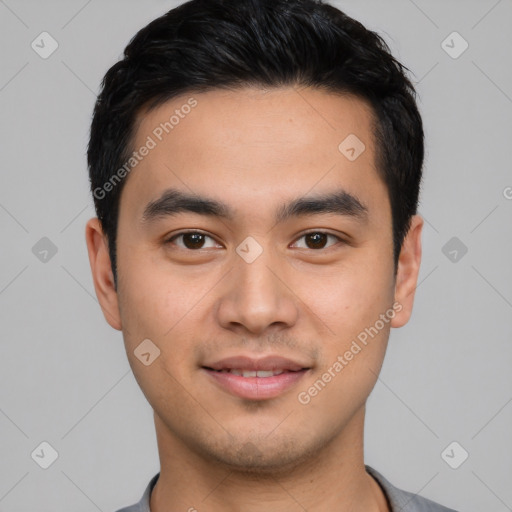 Joyful latino young-adult male with short  black hair and brown eyes