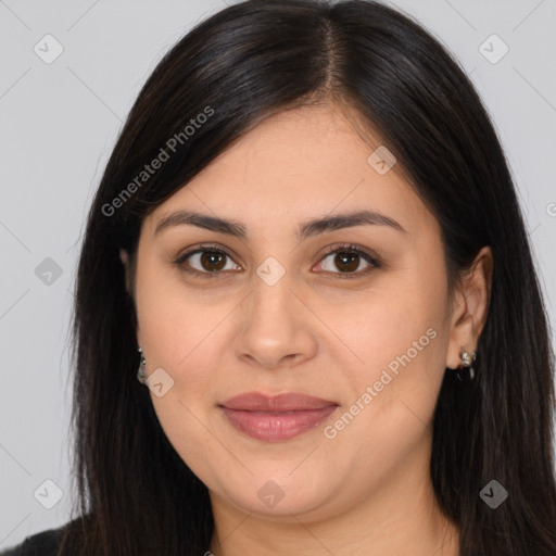 Joyful latino young-adult female with long  brown hair and brown eyes