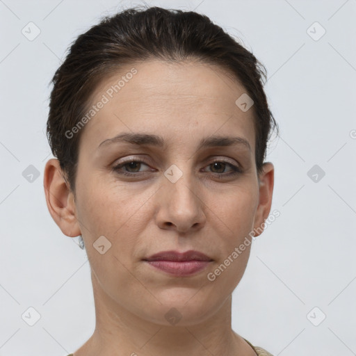 Joyful white adult female with short  brown hair and brown eyes