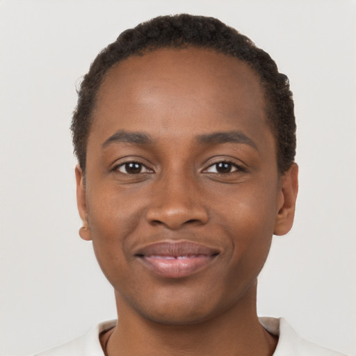 Joyful black young-adult male with short  brown hair and brown eyes