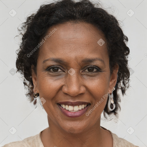 Joyful black adult female with short  brown hair and brown eyes