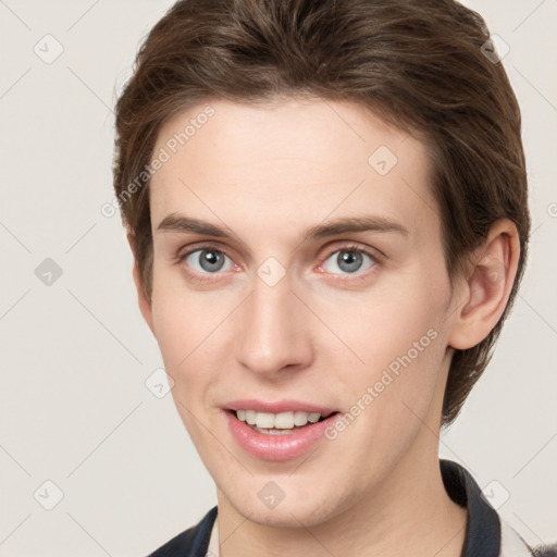 Joyful white young-adult female with short  brown hair and grey eyes