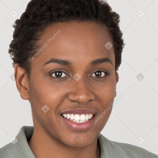 Joyful black young-adult female with short  brown hair and brown eyes