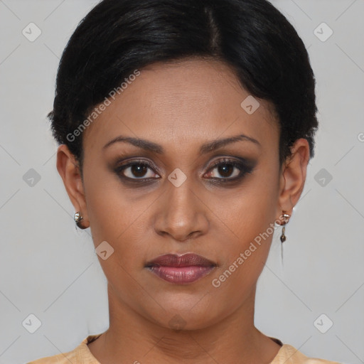 Joyful latino young-adult female with short  brown hair and brown eyes