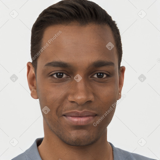 Joyful black young-adult male with short  brown hair and brown eyes