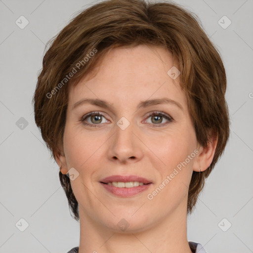 Joyful white adult female with medium  brown hair and grey eyes