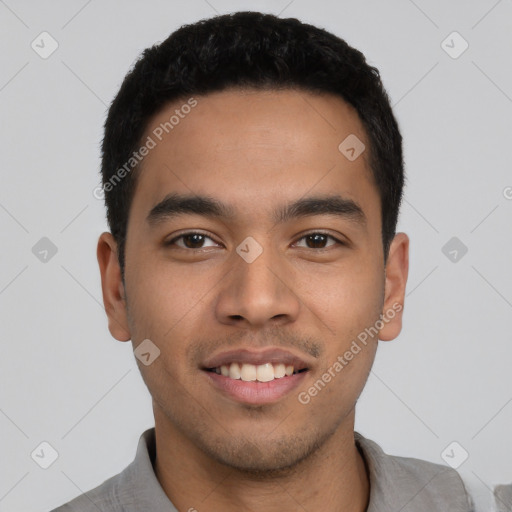 Joyful latino young-adult male with short  black hair and brown eyes